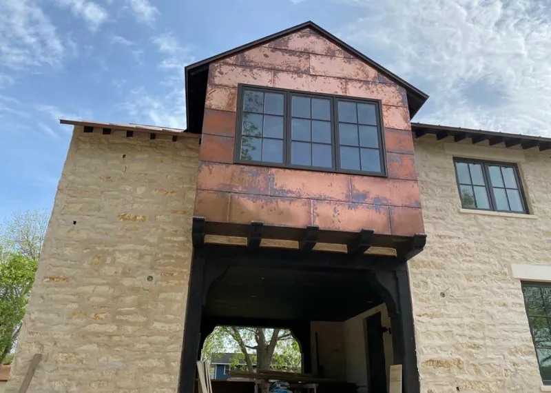 Copper metal panel facade on a stone building for Skylight Installation in Corona de Tucson